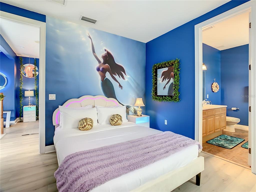 1424 Titian Court Reunion, FL 34747 - Photo 45 of 63 a bedroom with a bed and a view of bathroom