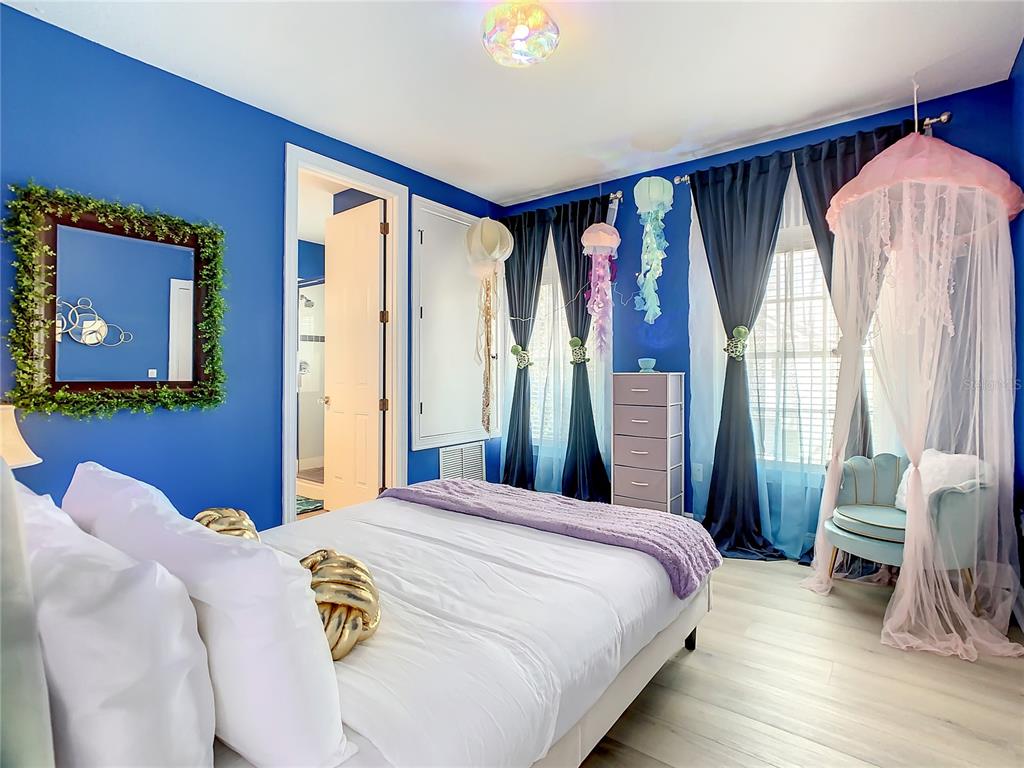 1424 Titian Court Reunion, FL 34747 - Photo 46 of 63 a bedroom with a bed and a window