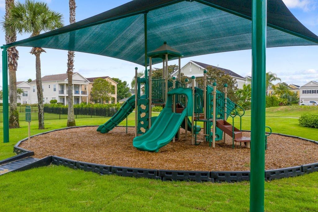 1424 Titian Court Reunion, FL 34747 - Photo 58 of 63 a view of outdoor space with playground and green space