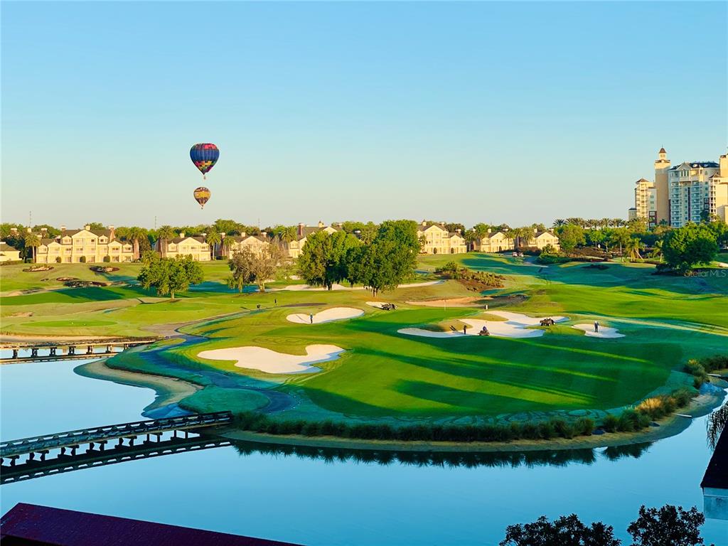 1424 Titian Court Reunion, FL 34747 - Photo 6 of 63 a view of a golf course with a lake