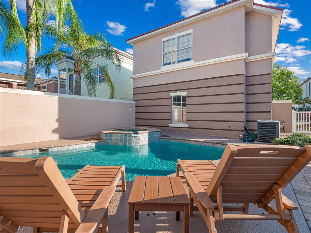 1424 Titian Court Reunion, FL 34747 - Photo 9 of 63 a view of a patio with table and chairs and potted plants