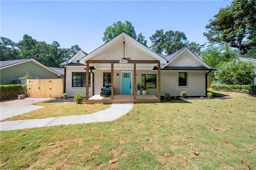 1839 Brannen Road Southeast Atlanta, GA 30316 - Photo 1 of 1 a front view of a house with a yard and garage
