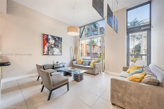 a living room with furniture and a large window