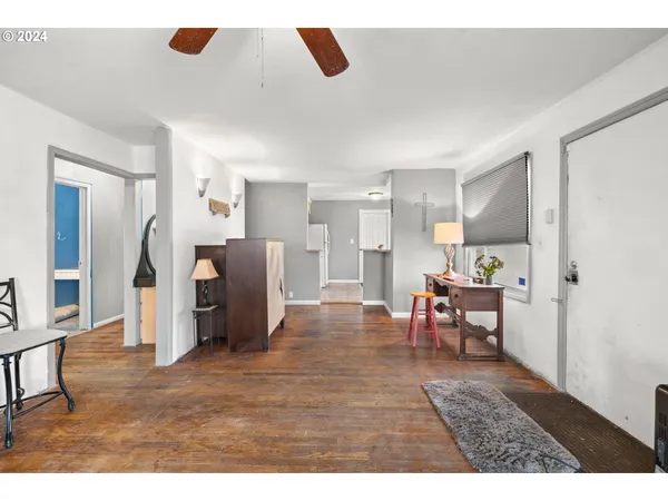 a view of kitchen with furniture and a refrigerator