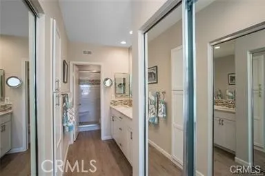 a bathroom with a glass door shower