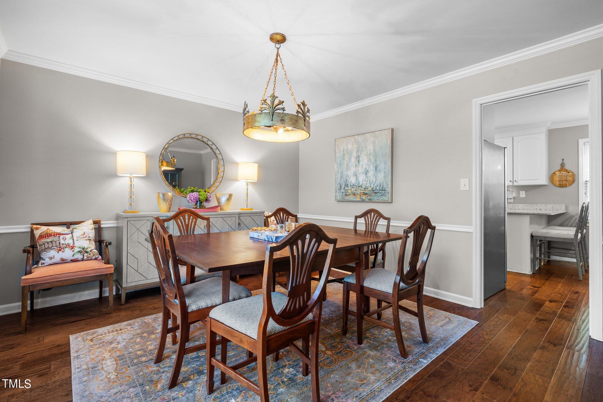 801 Purdue Street Raleigh, NC 27609 - Photo 11 of 40 a view of a dining room with furniture and wooden floor