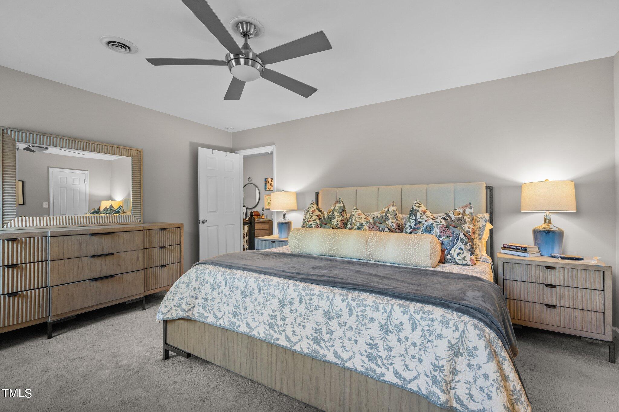 801 Purdue Street Raleigh, NC 27609 - Photo 28 of 40 a bed room with a bed and a dresser