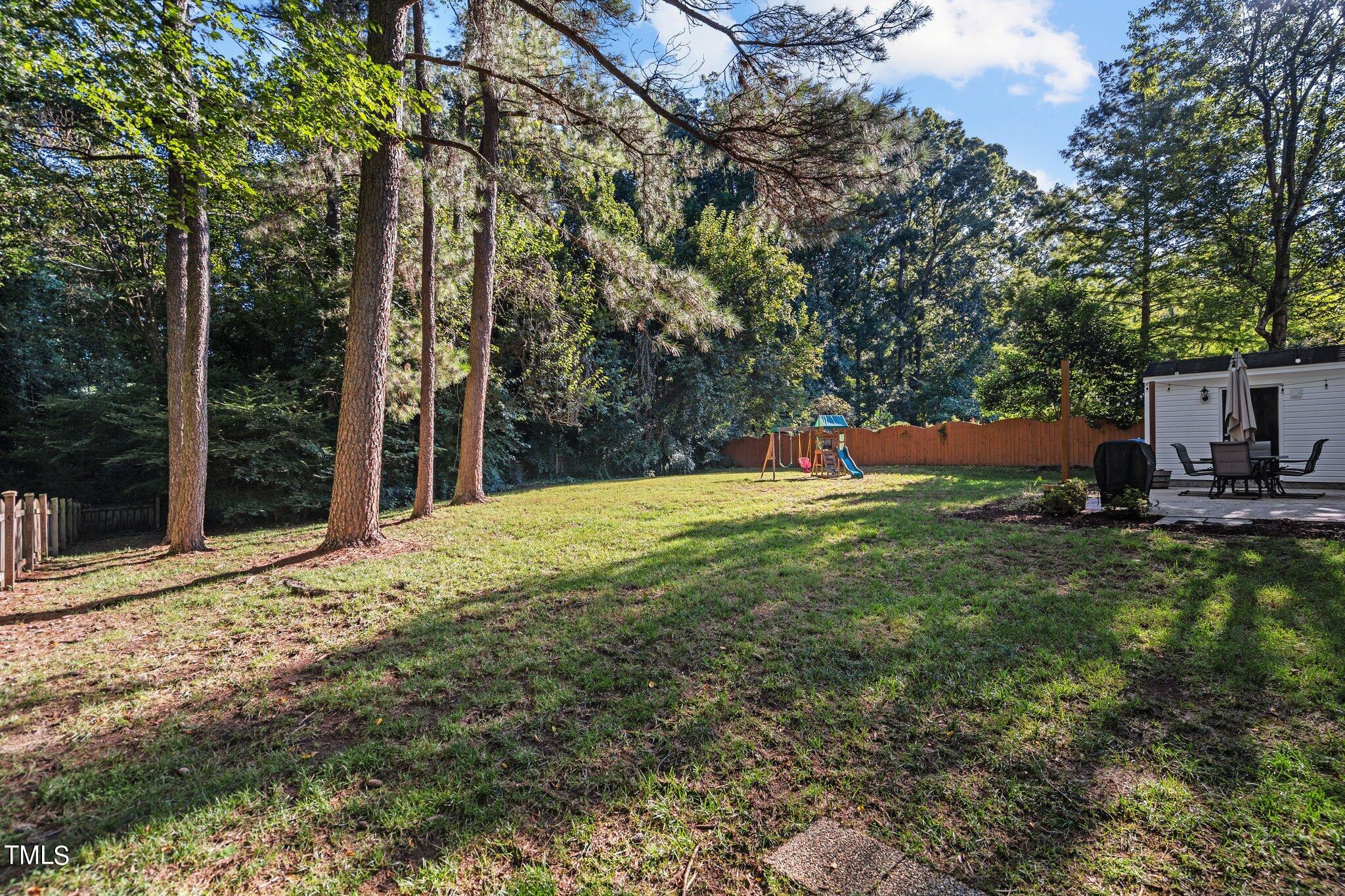 801 Purdue Street Raleigh, NC 27609 - Photo 34 of 40 a view of a house with yard and sitting area
