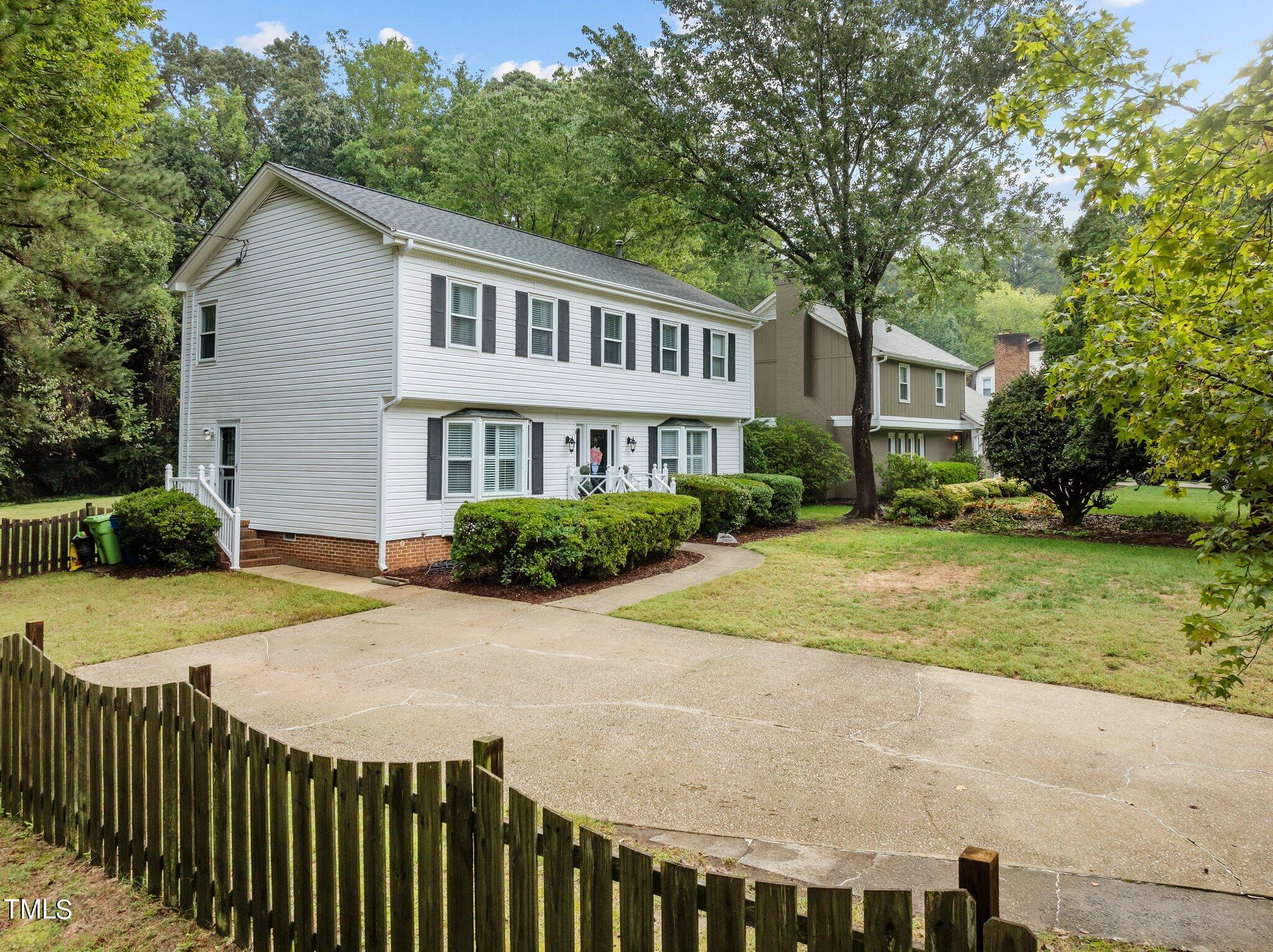 801 Purdue Street Raleigh, NC 27609 - Photo 37 of 40 a view of a house with a yard and plants