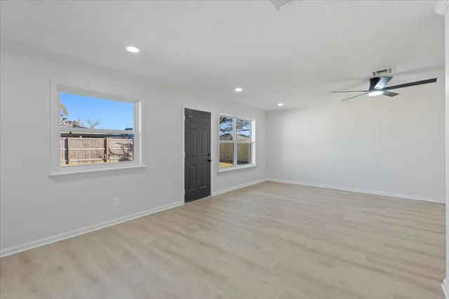 a kitchen with stainless steel appliances a sink stove and cabinets