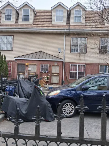 a front view of a house with parking space
