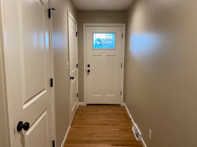 2225 7th Street Peru, IL 61354 - Photo 2 of 15 a view of a hallway with wooden floor and a bathroom