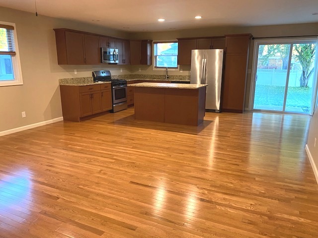 2225 7th Street Peru, IL 61354 - Photo 3 of 15 a view of kitchen and kitchen with furniture wooden floor and window