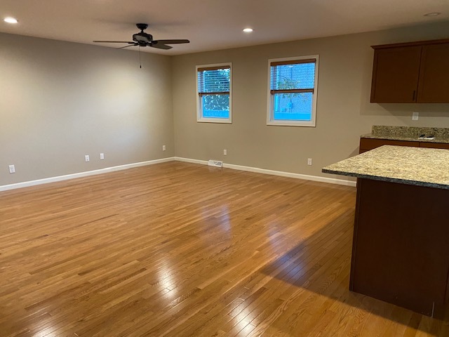 2225 7th Street Peru, IL 61354 - Photo 4 of 15 a view of an empty room with a window and wooden floor