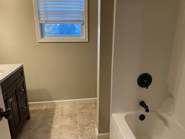 2225 7th Street Peru, IL 61354 - Photo 7 of 15 a bathroom with a bathtub