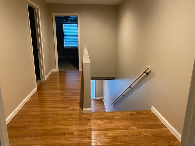 2225 7th Street Peru, IL 61354 - Photo 9 of 15 a view of a hallway with wooden floor and staircase