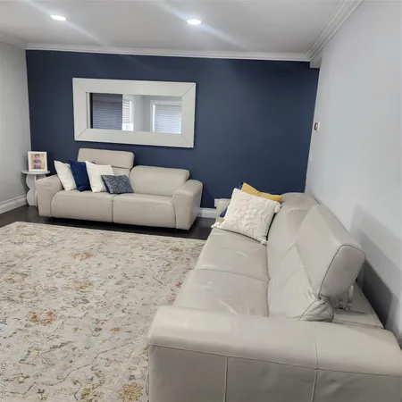 a large white bed in a white room