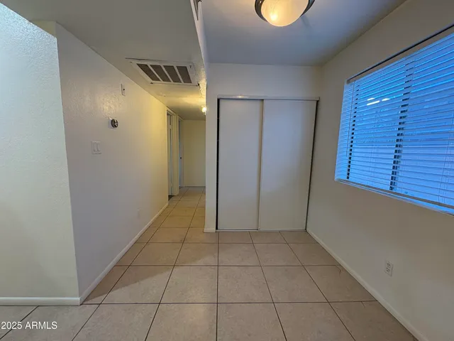 a view of an empty room with a window
