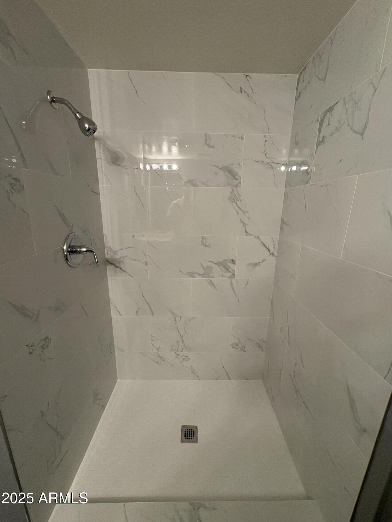 2938 North 61st Place, Unit 150 Scottsdale, AZ 85251 - Photo 19 of 24 a bathroom with a shower