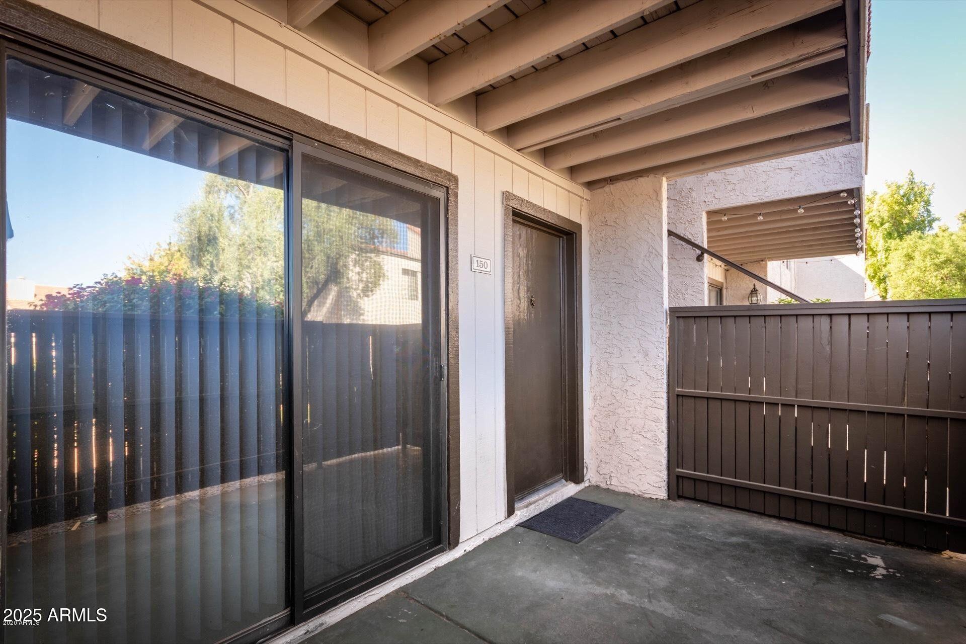 2938 North 61st Place, Unit 150 Scottsdale, AZ 85251 - Photo 2 of 24 a view of a porch