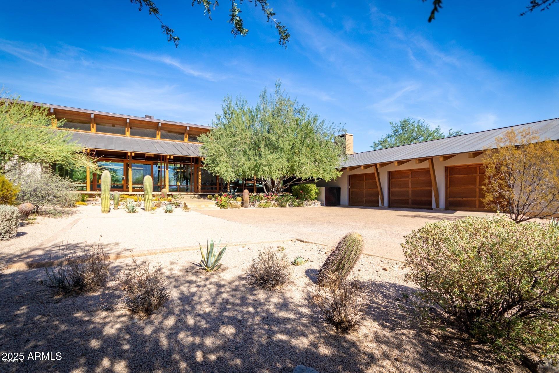 2938 North 61st Place, Unit 150 Scottsdale, AZ 85251 - Photo 24 of 24 a view of a house with a yard