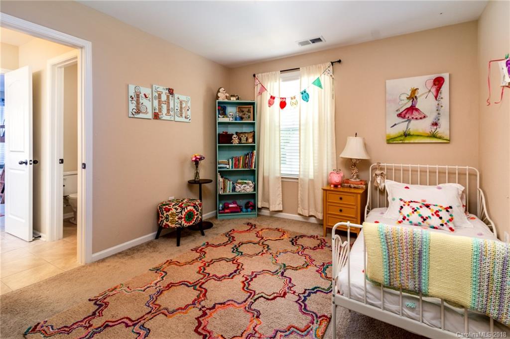 831 Solandra Way Tega Cay, SC 29708 - Photo 22 of 30 a bedroom with furniture and a bed