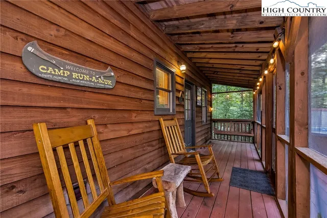 a view of deck with wooden floor and outdoor seating