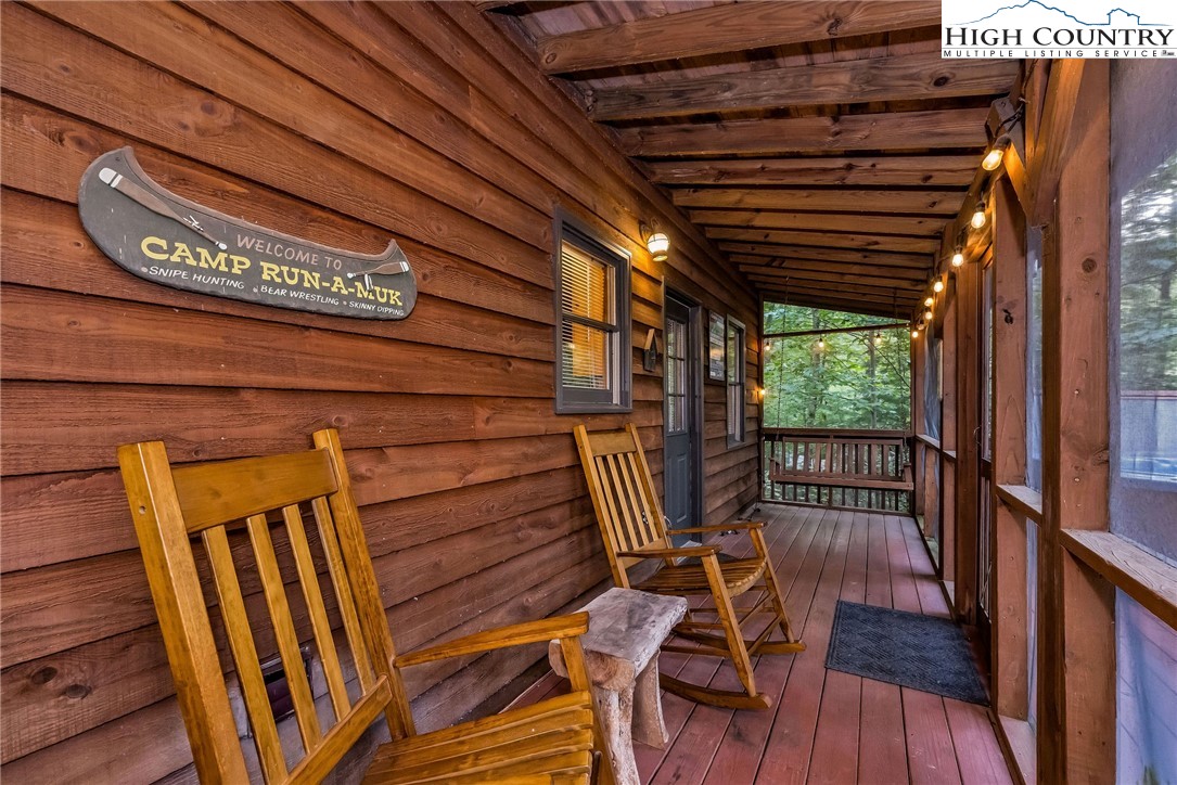 199 Skyline Road West Jefferson, NC 28694 - Photo 13 of 35 a view of deck with wooden floor and outdoor seating