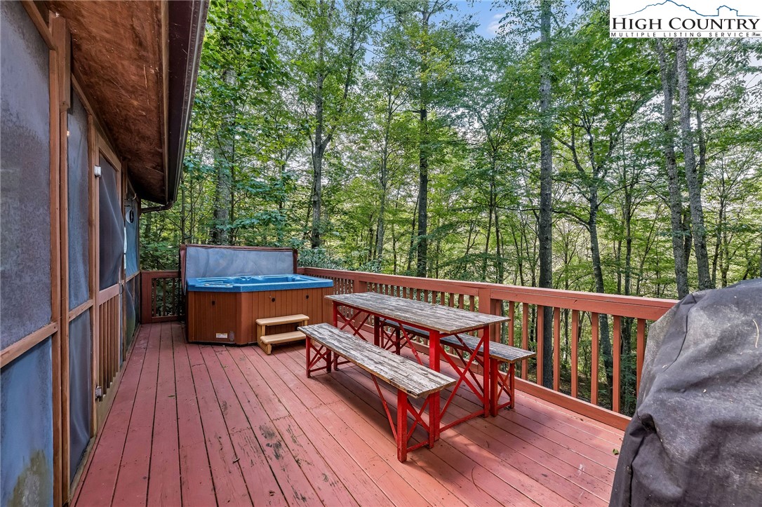 199 Skyline Road West Jefferson, NC 28694 - Photo 17 of 35 a view of balcony with wooden floor and outdoor seating