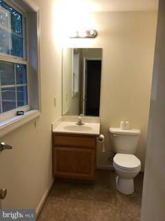 55 Buck Road Linden, VA 22642 - Photo 14 of 14 a bathroom with a toilet sink and mirror