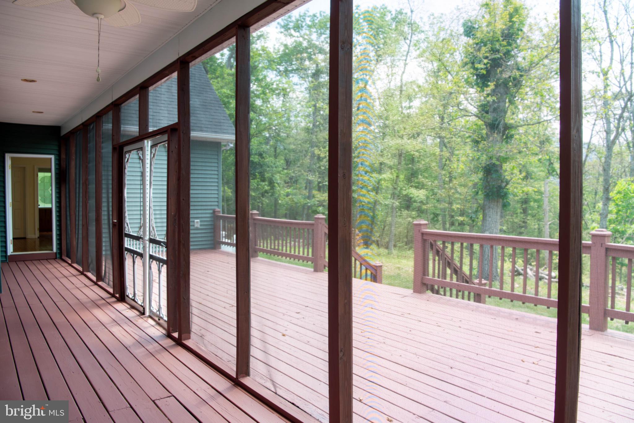 792 Forest Glen Road Moorefield, WV 26836 - Photo 80 of 146 Serene screened porch with nature views.