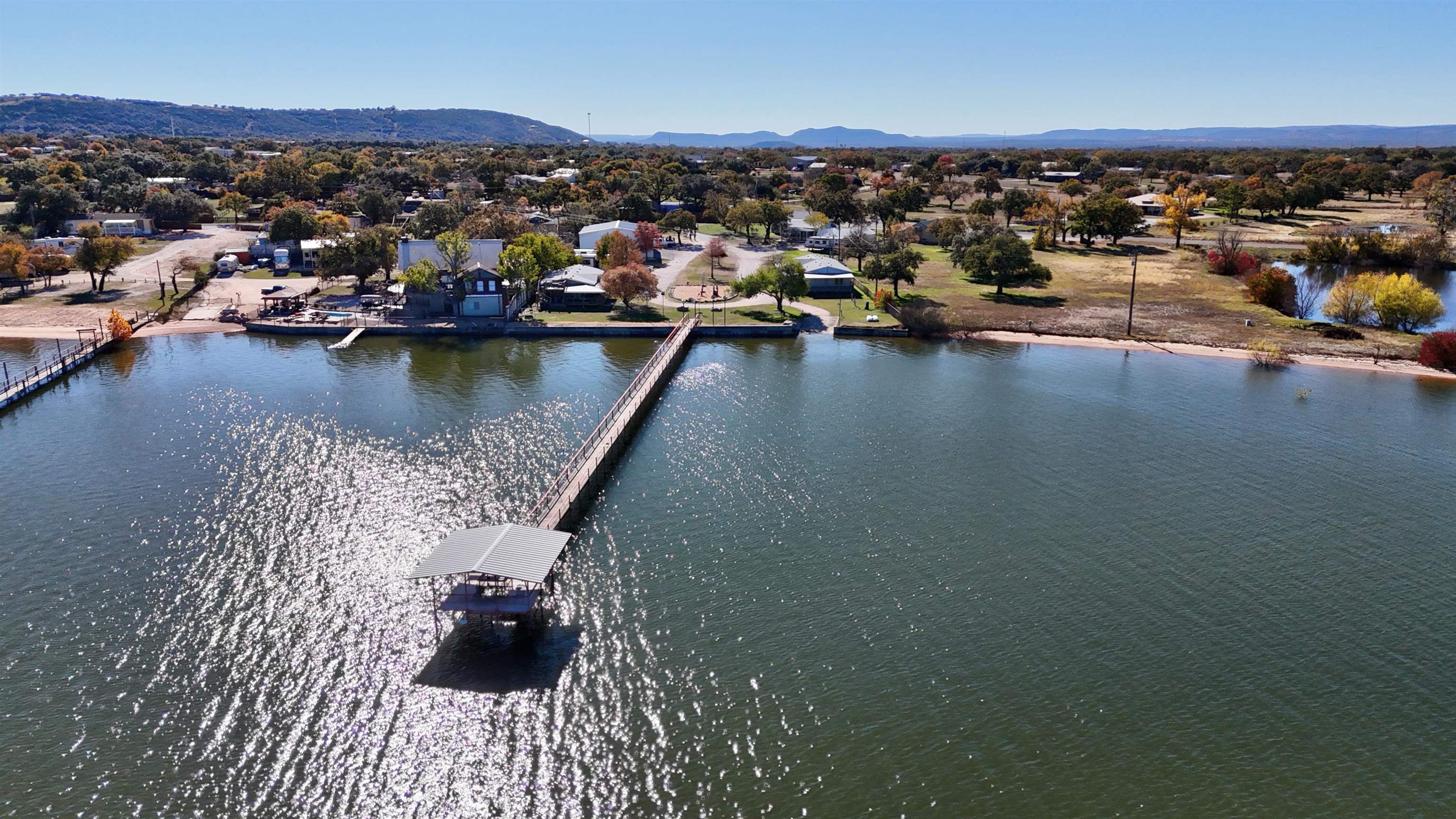 1504-2 Ranch Road 261 Buchanan Dam, TX 78609 - Photo 1 of 22 an aerial view of a houses with a lake view