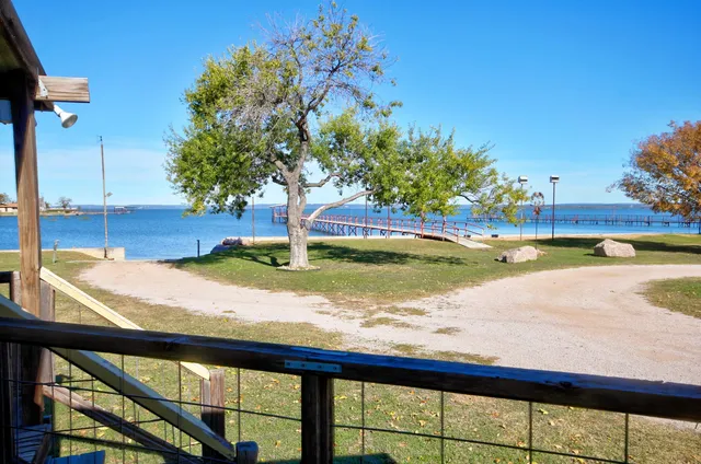 a view of a swimming pool with a yard