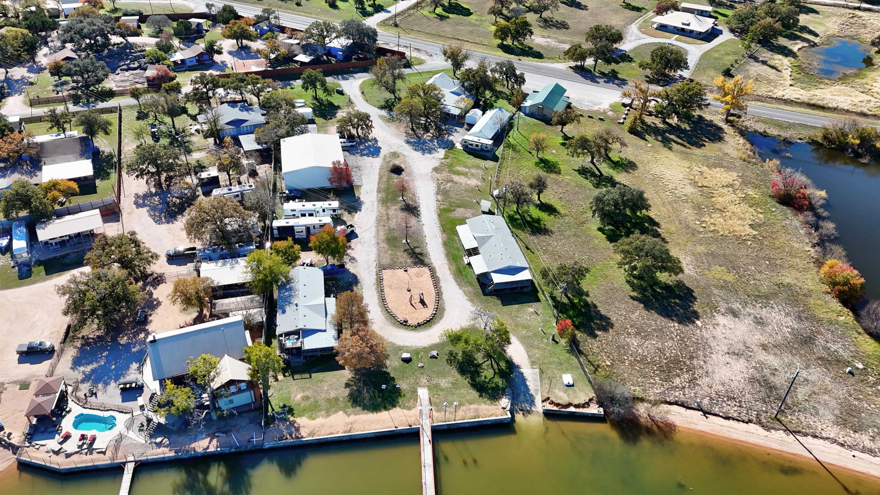 1504-2 Ranch Road 261 Buchanan Dam, TX 78609 - Photo 2 of 22 an aerial view of residential house with outdoor space and swimming pool
