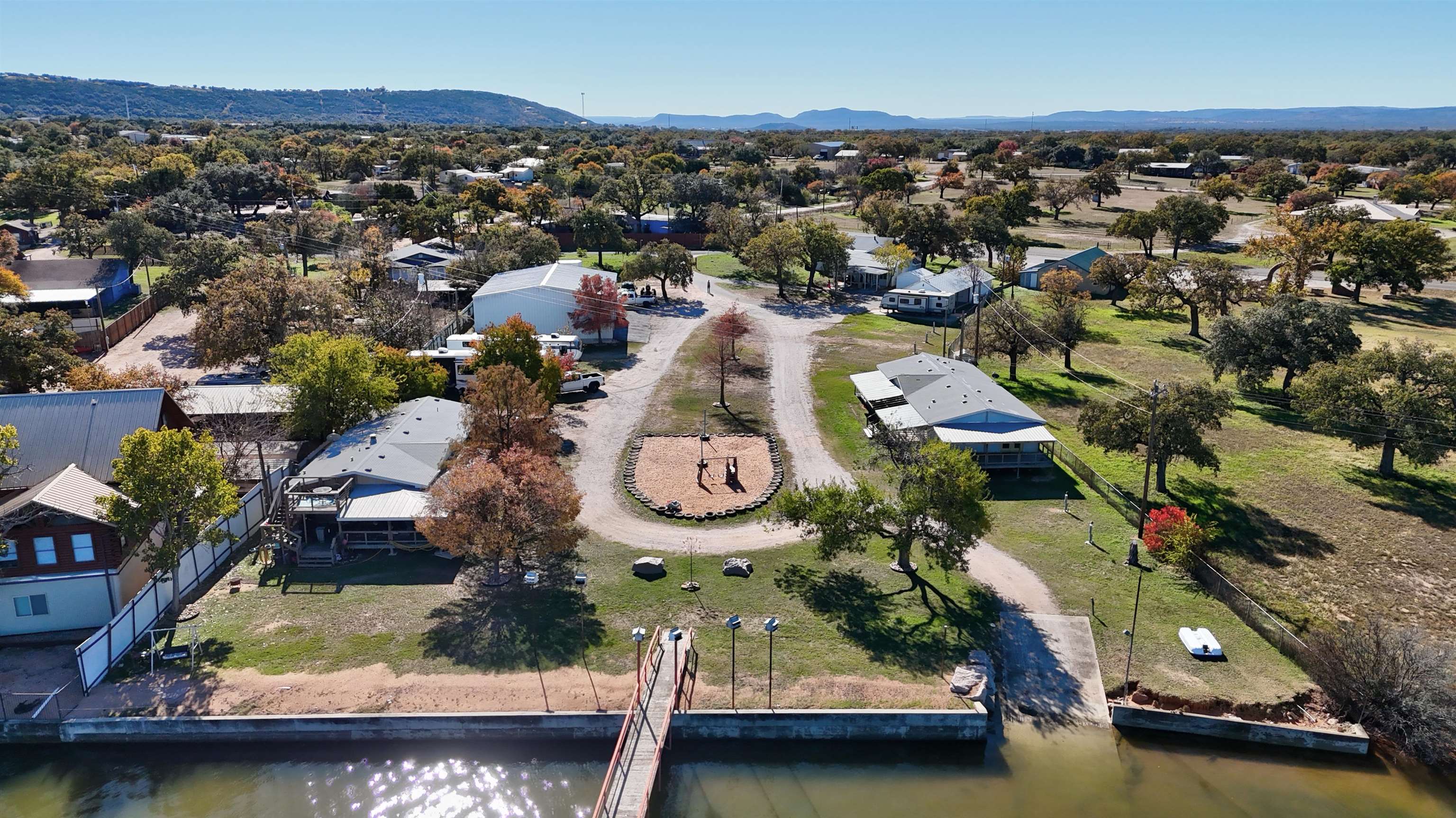 1504-2 Ranch Road 261 Buchanan Dam, TX 78609 - Photo 3 of 22 an aerial view of residential houses with outdoor space