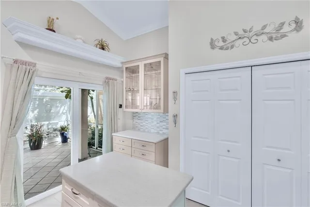 a en suite bathroom with a granite countertop sink and a mirror