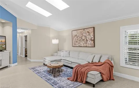 a kitchen with a refrigerator a sink and cabinets
