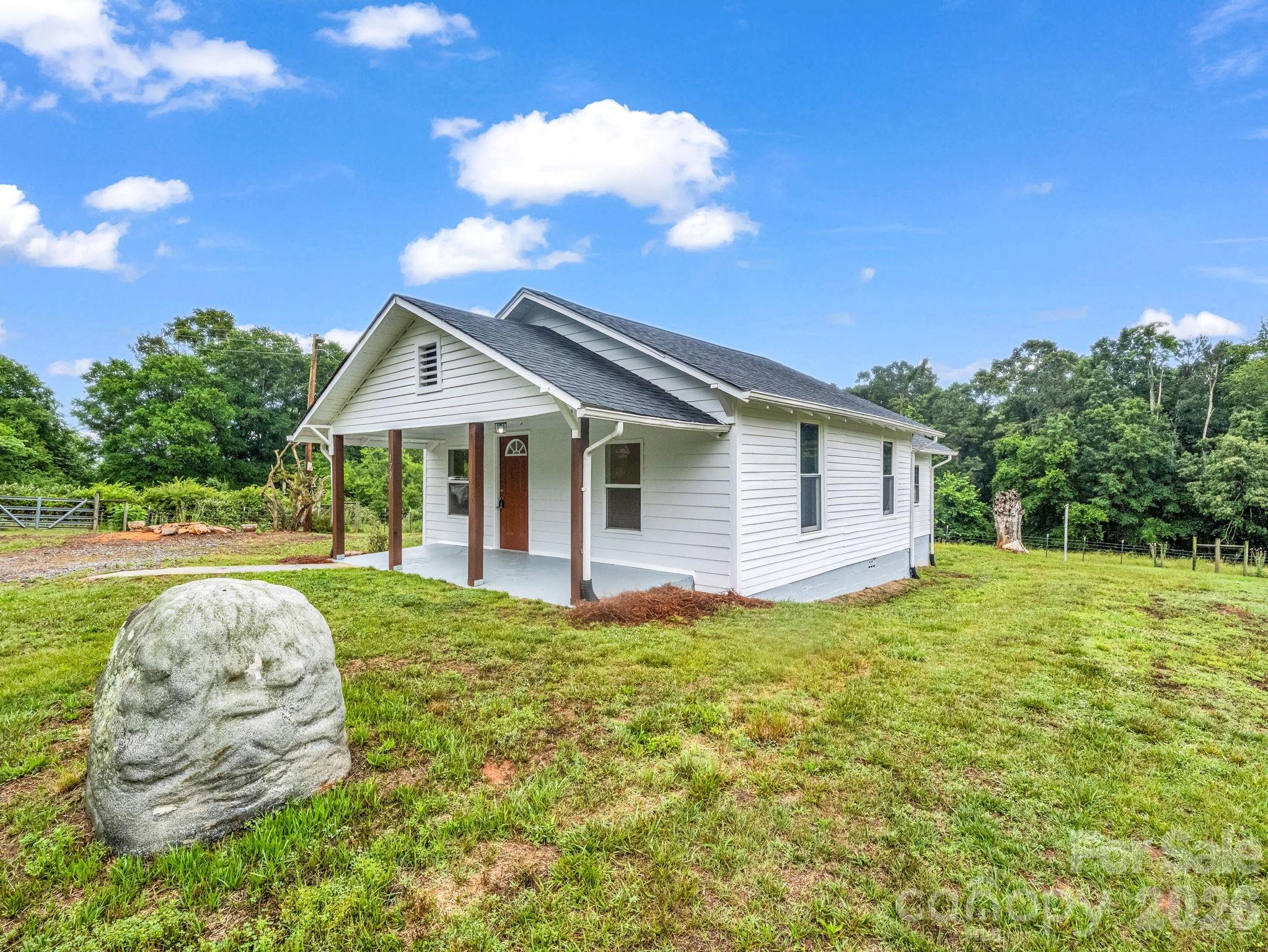 170 Dobbins Road Ellenboro, NC 28040 - Photo 2 of 32 a view of a house with backyard and sitting area