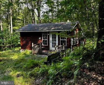 a view of house with yard