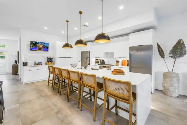 a bedroom with a bed and a potted plant