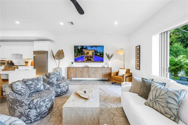 a living room with furniture and a large window