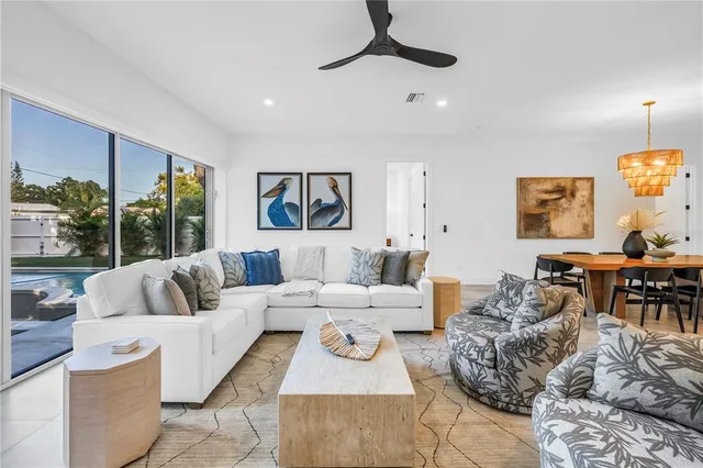 a bedroom with a large bed and a large window