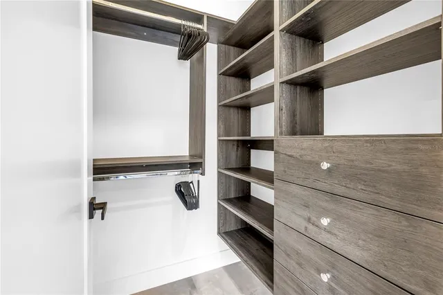 a bedroom with a bed and a desk