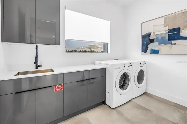 a bathroom with a granite countertop shower a toilet and a sink