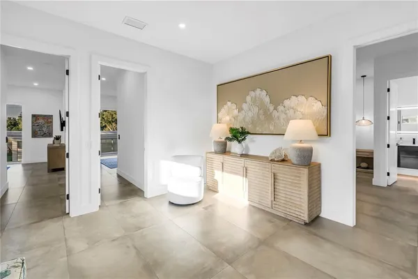 a bedroom with a bed and a book shelf