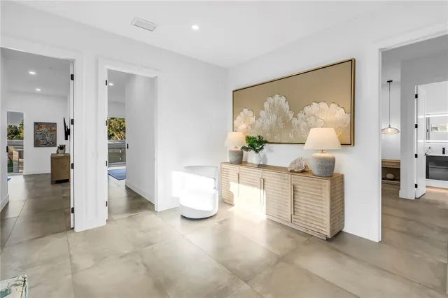 a bedroom with a bed and a book shelf