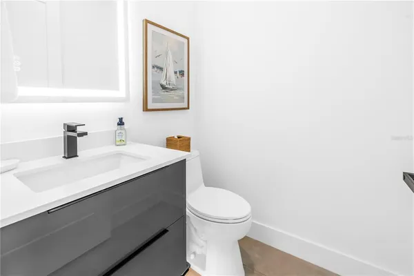 a kitchen with cabinets and stainless steel appliances