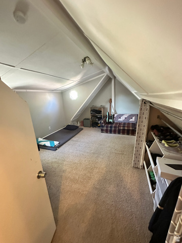 541 300 North Provo, UT 84606 - Photo 35 of 36 Carpeted attic space with sloped ceilings and exposed beams