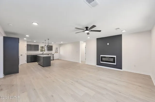 a view of a kitchen with a sink cabinets and window