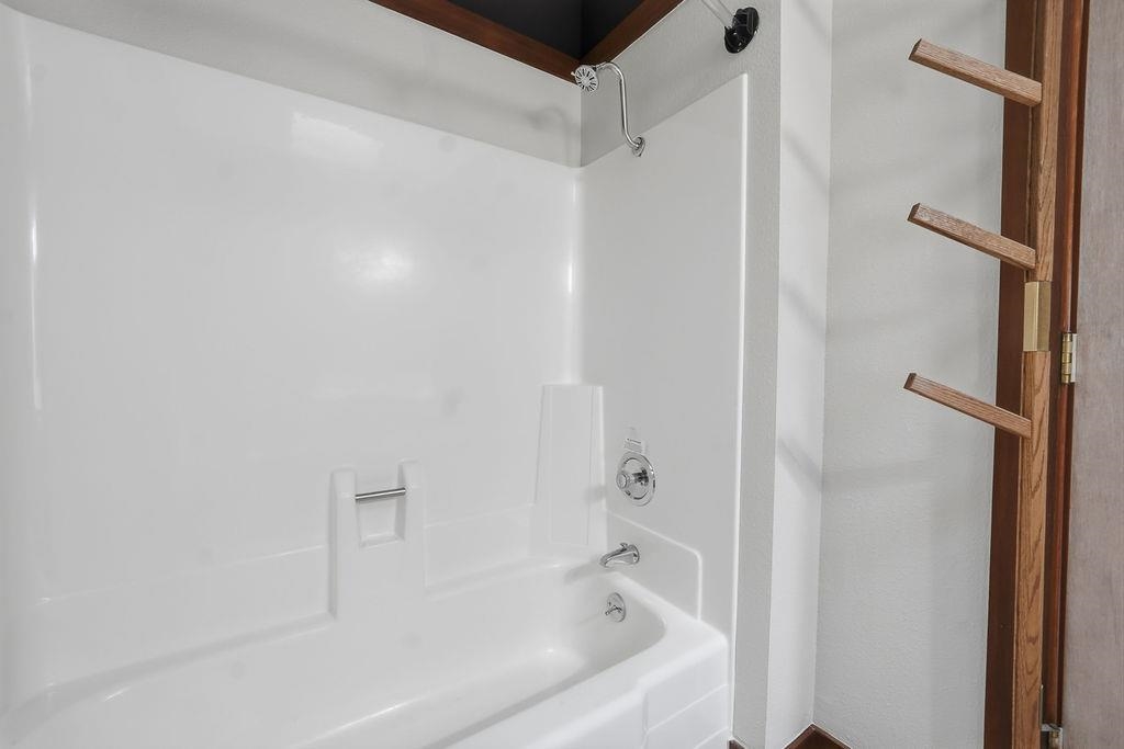 39 Graeagle Meadows Road, Unit 39 Graeagle, CA 96103 - Photo 19 of 48 a bathroom with a bathtub and a shower